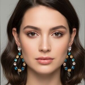 Elegant earrings with crystal stones in blue, pink and gold tones